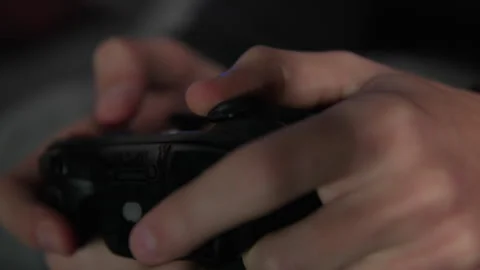 Extreme Close-up Of Hands Holding A Controller Playing Video Games Stock Footage 307704398