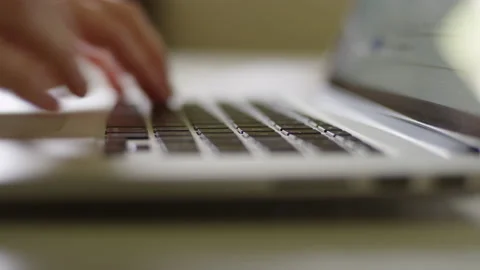 Extreme close up on hands typing on a laptop Video stock 134267933