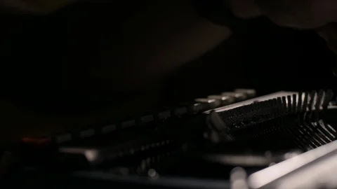 Extreme close up of hands typing on an old dusty vintage typewriter in slow moti Stock Footage 97762557