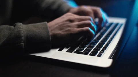 Extreme close-up hands of unrecognizable hacker programmer working typing on Stock Footage 145122054