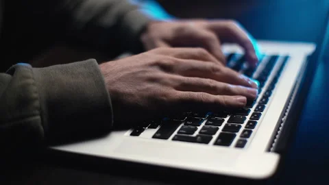 Extreme close-up hands of unrecognizable hacker programmer working typing on Video stock 145122105