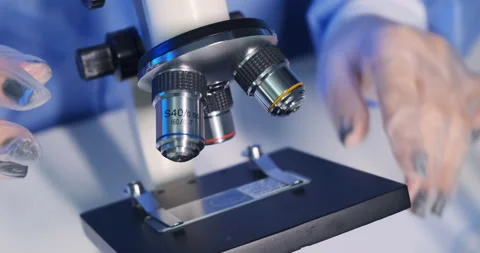 Extreme close-up high key light shot of microbiologist works with bacteria Stock Footage 152675423