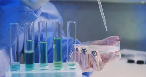 Extreme close-up high key light shot of microbiologist works with bacteria virus 動画素材 152978170