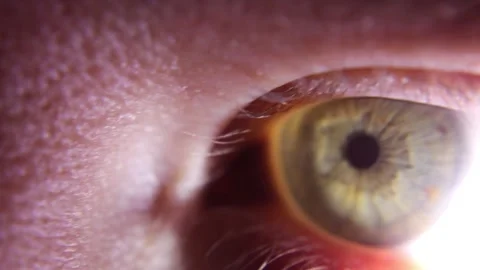 Extreme close up of human eye with bright light Video stock 143412345