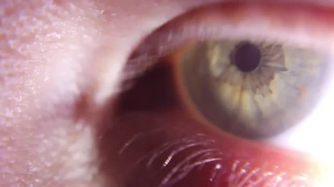 Extreme close up of human eye with bright light Video stock 143412637