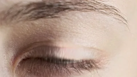 Extreme close up of human eye iris in 4K video. Female with beautiful makeup Stock Footage 155958871
