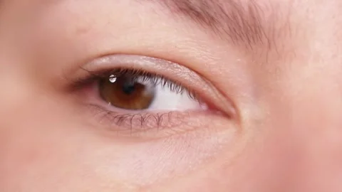Extreme close-up of a human eye with a reflection in the iris Stock Footage 339212389