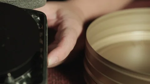 Extreme close up inside 16mm motion picture film running through a film camera Stock Footage 127245886