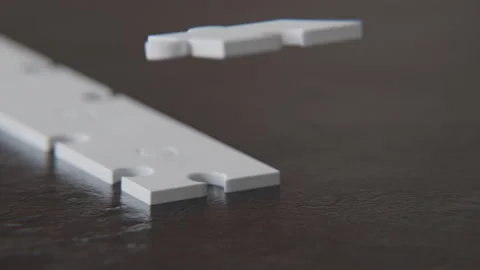Extreme Close up of an Interlocking 3d Animated Puzzle on the table Stock Footage 253549959