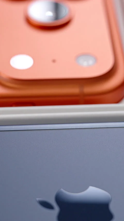 Extreme Close-Up of iPhone 17 Pro Devices in Deep Blue and Cosmic Orange Colors Stock Footage 318051136