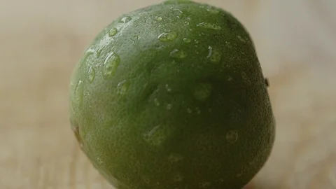 EXTREME CLOSE UP A LEMON BEING CUT Stock Footage 107301568