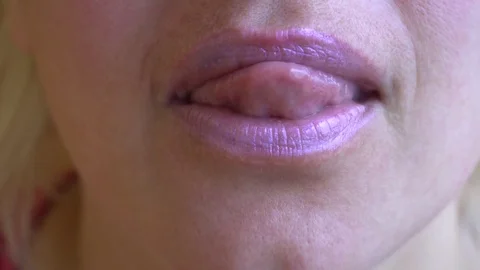 Extreme close up of licking lips and smiling Stock Footage 76212442