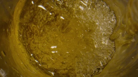 Extreme close up of liquid being poured into glass Stock Footage 340903789