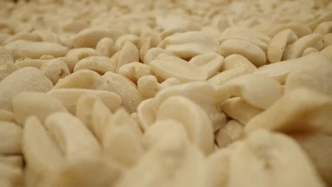 Extreme close-up lot of roasted peanuts, forward slide camera movement Stock Footage 124431918