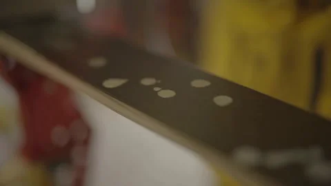 Extreme close-up of machine spreading wax Video stock 345804574