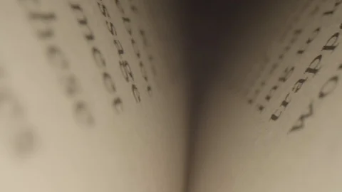 Extreme Close Up Macro of Camera Moving Forward In Binding of Book Stock Footage 116956739