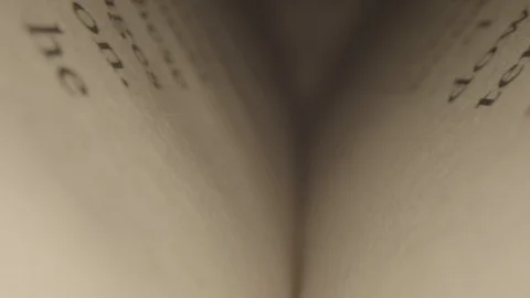 Extreme Close Up Macro of Camera Moving Back In Binding of Book Stockbeeldmateriaal 116956761