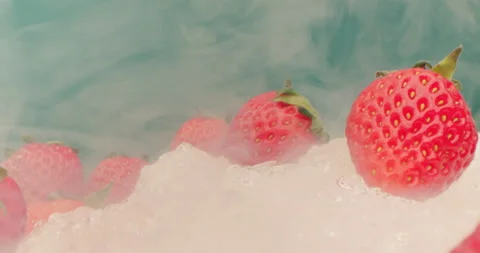 Extreme close-up, macro detailed, red strawberries lie on dry ice in smoke Stock Footage 238440457