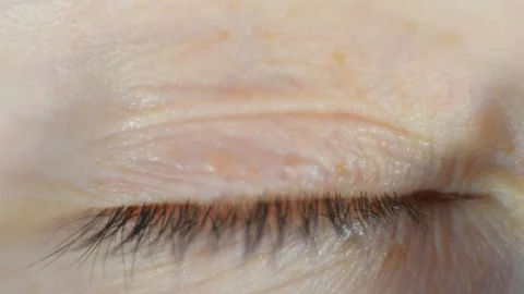 Extreme close-up macro eye freckled face of red haired woman with blue eyes Stock Footage 127697481