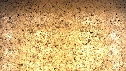 Extreme close up macro on a instant tea grains, dissolves in moving hot water Stock Footage 144431551