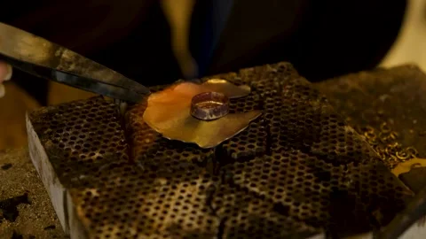 Extreme Close Up Macro Shot of Torch Heating Gold Jewelry Stock Footage 327863829