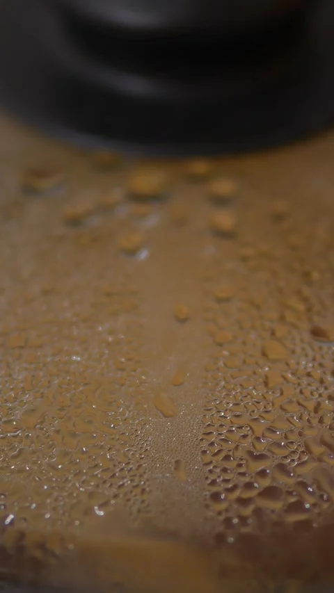 Extreme close-up macro shot of a transparent glass Stock Footage 329116694