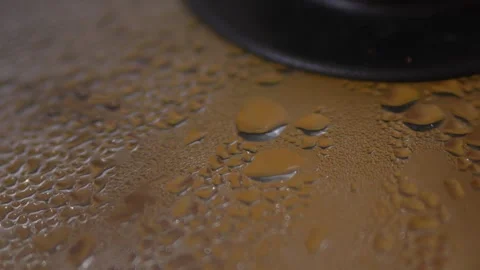 Extreme close-up macro shot of a transparent glass Stock Footage 329116884