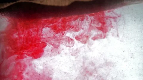 Extreme close up macro on a tea bag dipped in hot water and dissolves Stock Footage 144431264