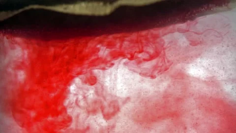 Extreme close up macro on a tea bag dipped in hot water and dissolves Stock Footage 144431362