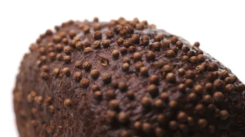 Extreme close up macro view of beautiful loaf of black bread with sprinkles Stock Footage 148509416