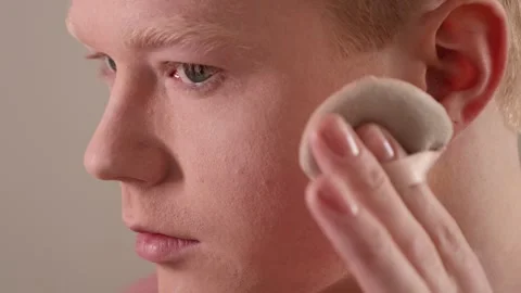 An Extreme Close-Up Of A Man Applying Powder Makeup Mirror Beauty Routine Stock Footage 309436596