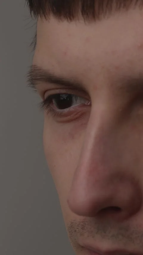 Extreme close up of a man eye looking at laptop screen with reflection Stock Footage 335082349
