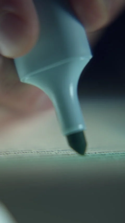 Extreme Close-Up of Man Highlighting Text with Blue Highlighter Stock Footage 343756526