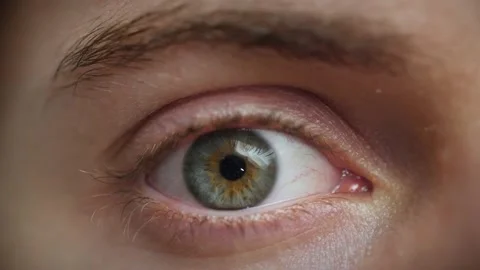 Extreme close up of Man opening eye. Beautiful blue green iris and retina. Stock Footage 142908562