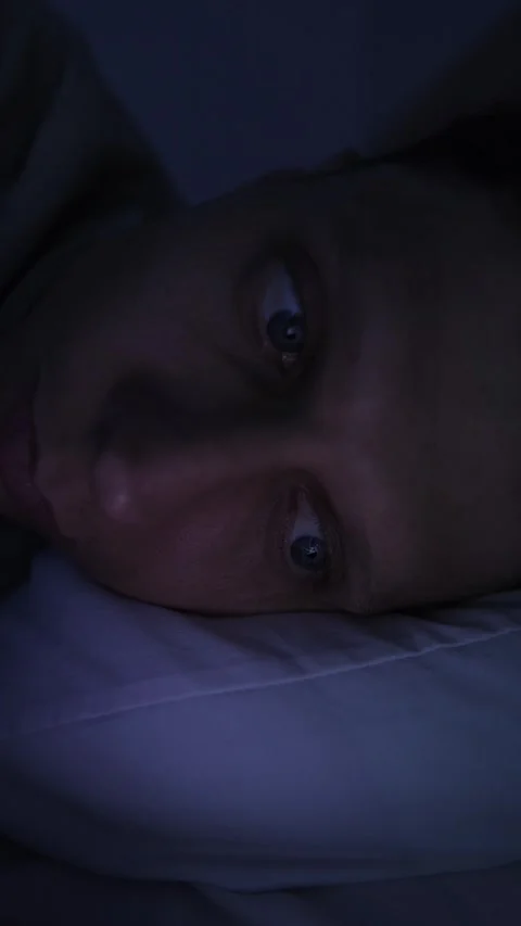 Extreme close up of man scrolling digital content at night, changing screen 스톡 동영상 346247327