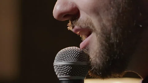 ​​Extreme Close Up of Man Speaking into Microphone on Stage Stock Footage 333228352