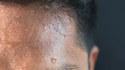 Extreme close up of man sweating on forehead after intense exercise or unde.. Stock Footage 333030589