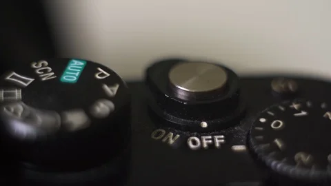 Extreme close up man turning on old dirty camera with dust on it. Stock Footage 122069229