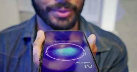 Extreme close up of a man using AI voice assistant feature on smartphone. Stock Footage 335851719