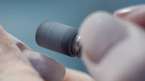 Extreme Close-up, Manicure Master Cleans the Lacquer Layer with Nail on Woman's Stock Footage 92177171