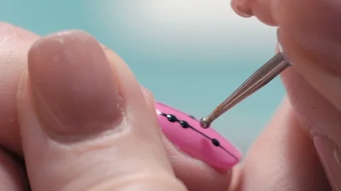 Extreme Close-up, Manicure Master Decorates Girl's Nail, Puts on Pink Lacquer Stock Footage 92205525