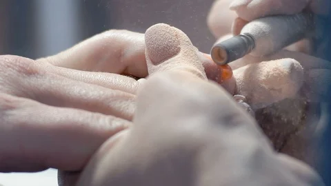 Extreme Close-up, Manicure Master Slices Old Luck Layer with Fingernail on Girl Stock Footage 92178295