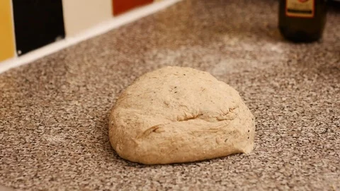 Extreme close up of a man's hand kneading bread dough. Stock Footage 72788012