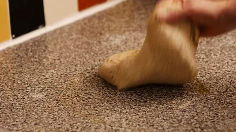 Extreme close up of a man's hand kneading bread dough. Stock Footage 72788133