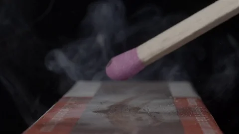Extreme close up of a match being lit. Filmed in super slow motion. Macro lens. Stock Footage 75656684