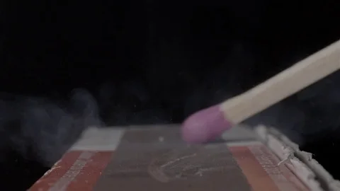 Extreme close up of a match being lit. Filmed in super slow motion. Macro lens. Stock Footage 75656708