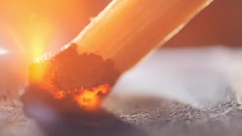 Extreme close up of a match lights in slow motion Stock Footage 194482962