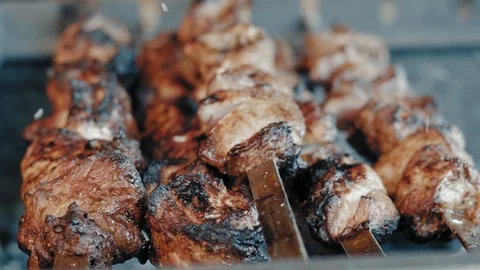 Extreme Close-Up Meat is Roasted on Coals in a Street Restaurant Stock Footage 113019186