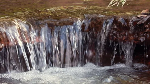 Extreme Close Up Of A Miniature Waterfall In A Forest Brook. Stock Footage 312960108