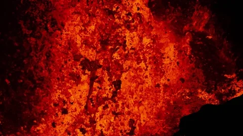 Extreme close up of molten lava exploding from active volcano crater Stock Footage 246500964
